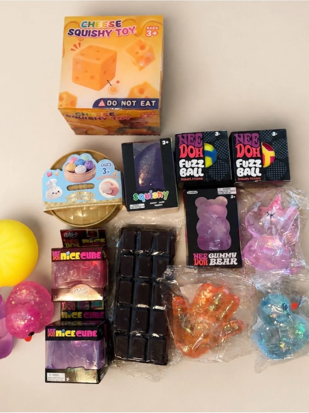 NEE DOH Assorted Fizz & Gummy Squishy Toy Bundle - Pink, Purple, Yellow, Blue